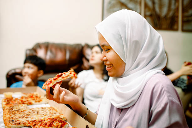 istock dinner party at home with pizza 1319535813