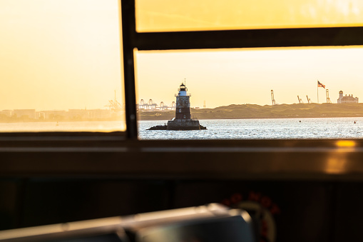 Robbins Reef Lighthouse and Bayonne Golf Club, shot from the Staten Island Ferry