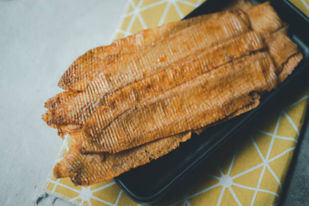 istock Crispy dry squids with spicy and sweet flavors. Thai appetizer 1319544016