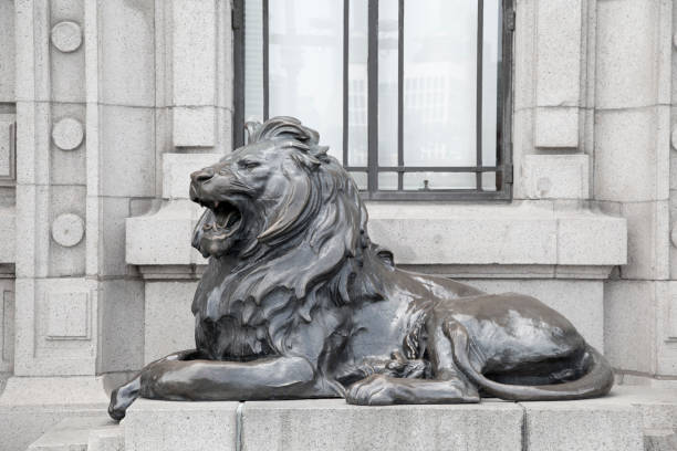 istock Bronze lion statue in front of the building. 1319545600