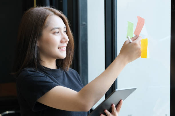 istock A female company employee using notepad and tablet to analyze company budgets 1319546176