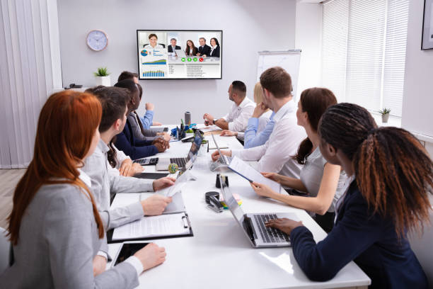 istock Businesspeople Having Video Conference In Boardroom 1319546937