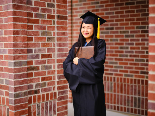 istock Adult Graduate Celebrating 1319548850