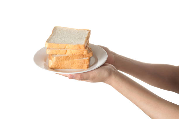 istock Chef holding toast wheat bread sliced isolated on white background 1319555831