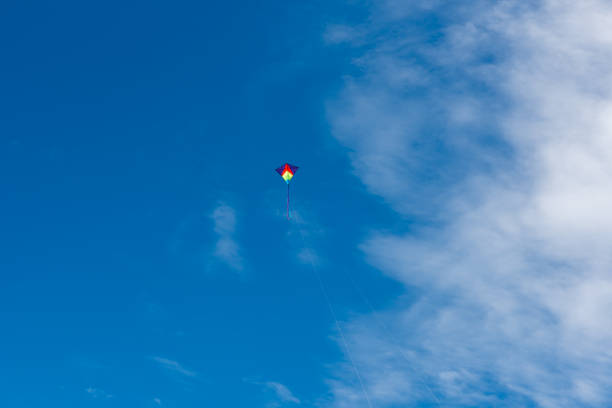 istock Colorful Kites flying over the sky 1319559491