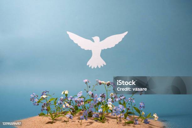 Flowers And White Paper Dove On Light Background Stock Photo - Download Image Now - Pentecost - Religious Celebration, Dove - Bird, Pigeon