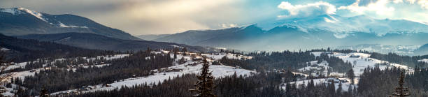 istock Sun rays at sunset in winter in the mountains 1319559674