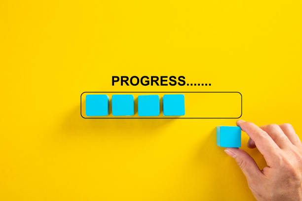 istock Hand putting wooden cube on virtual infographic rectangleblock with progress wording. Job progressive concept. 1319560579