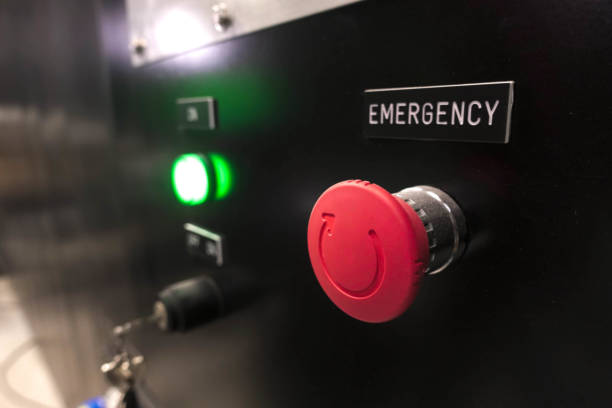 istock Red alarm button on the black wall 1319562361