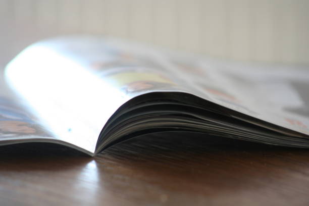 istock Opened book with reflection seeing the left side of it 1319563191