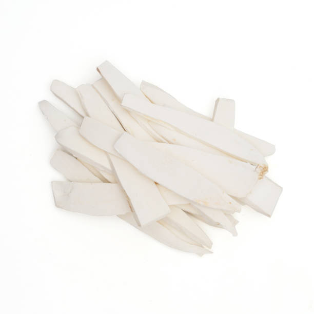 istock shan yao dried chinese yam isolated  on white 1319564307