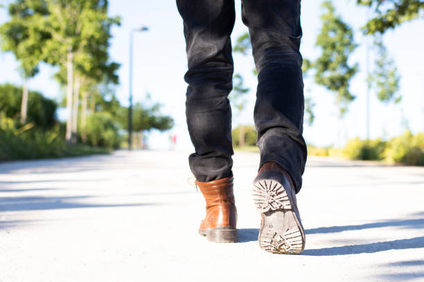istock walking in the park in brown boots. selective focus. copy space 1319566461