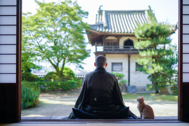 A photo of a Japanese monk doing zazen A photo of a Japanese monk doing zazen cross legged stock pictures, royalty-free photos & images