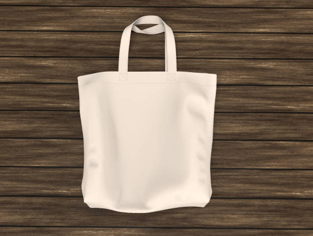 istock Blank tote bag mock up design on wood background 1319570287