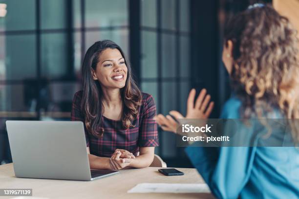 Colleagues Discussing Business Stock Photo - Download Image Now - Job Interview, Discussion, Talking