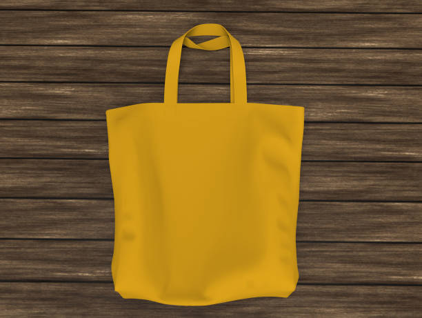 istock Blank tote bag mock up design on wood background 1319572042