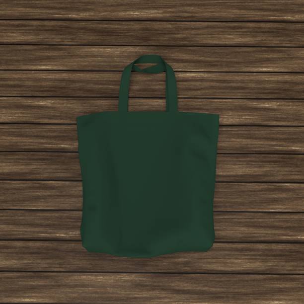 istock Blank tote bag mock up design on wood background 1319572050