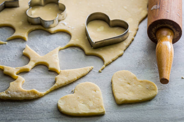 istock Cutting dough for milky biscuits. Preparation of butter biscuits. 1319573397