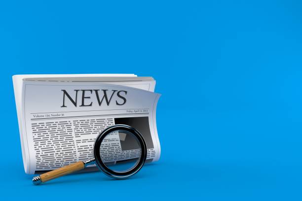 istock Newspaper with magnifying glass 1319574747