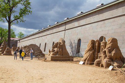 Saint-Petersburg, Russia - 22.05.2021: Festival of sand figures on the beach of the Peter and Paul Fortress in St. Petersburg  is traditional and invariably attracts crowds of citizens and tourists