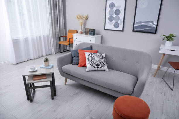 istock Stylish grey living room interior with comfortable sofa 1319577039
