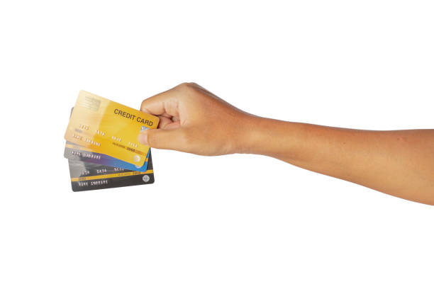 istock Hand holding credit card isolated on white background. 1319577051