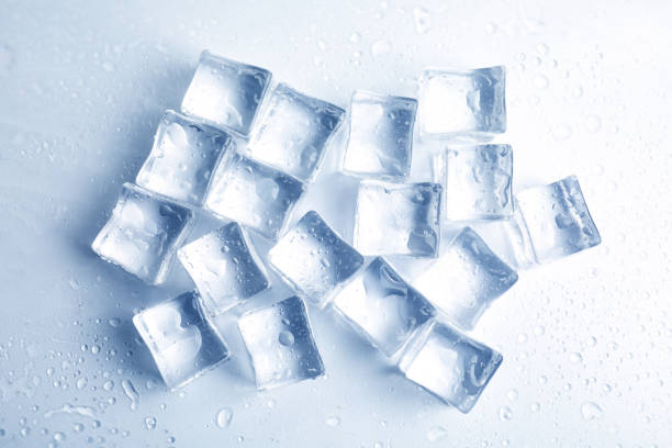 istock Ice cubes with water drops on white background, top view 1319577202