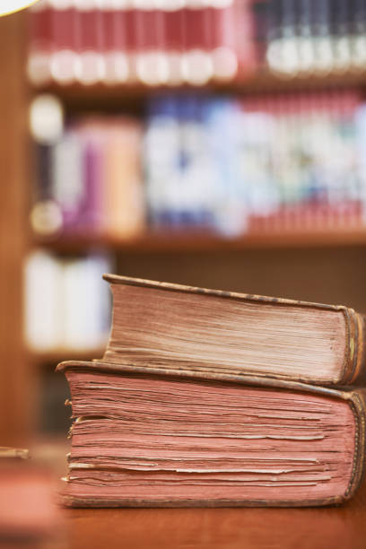 istock Very old books in library 1319578198