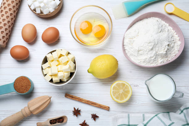 istock Cooking utensils and ingredients on white wooden table, flat lay 1319578223