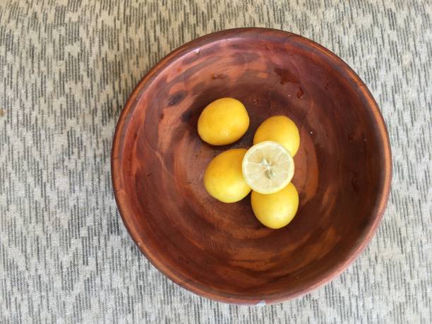 Sliced Lemons in a wooden bowl