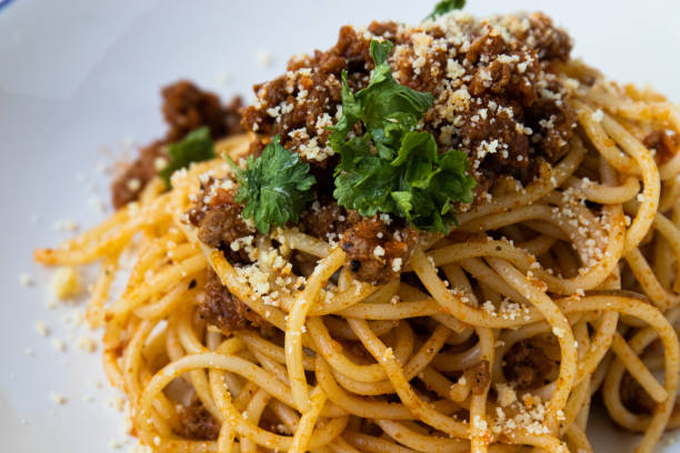 istock Home made Italian  spaghetti bolognese on white background 1319579832