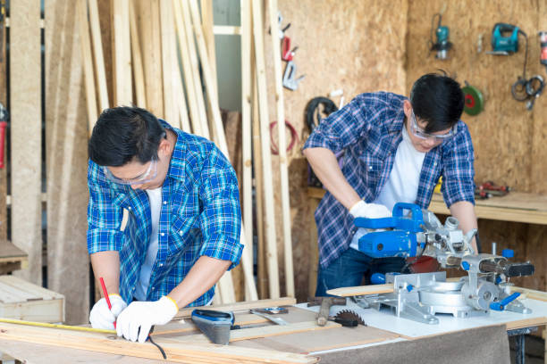 istock Worker or Professional constructor repair in wood working. Carpenter working with belt grinding machine. 1319581951