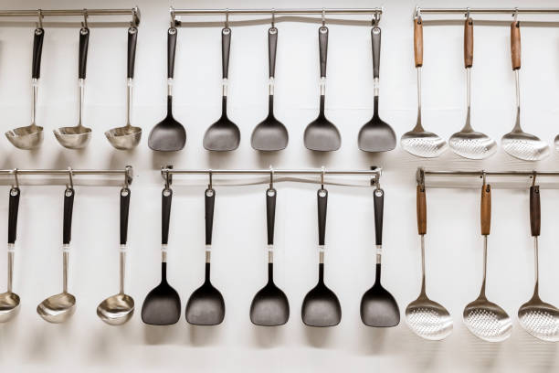 istock Close-up of kitchen utensils hanging on hooks 1319582558