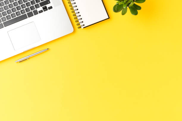 istock Office desktop concept with laptop, notebook and pen. Business background. Top view 1319582696