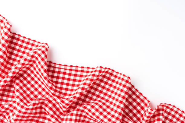 istock Overhead shot of red checkered table cloth with copyspace 1319582724