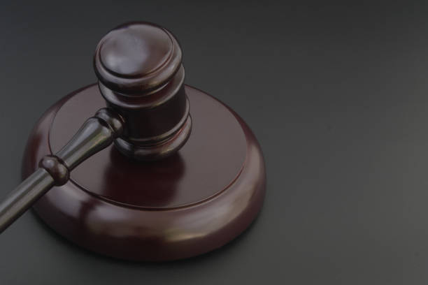 istock Wooden judge gavel on dark table with room for text 1319584092