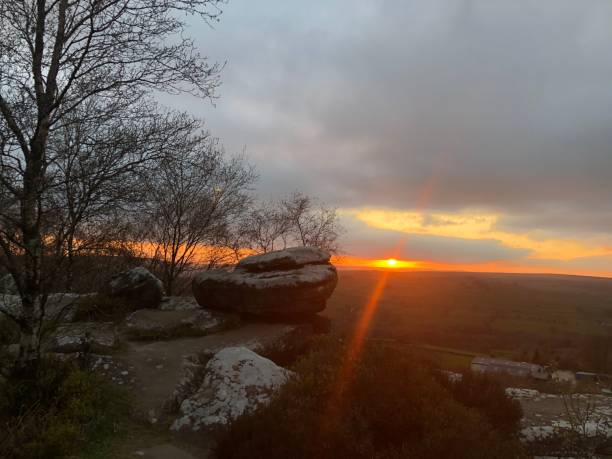istock Brimham Rocks, Setting Sun over Yorkshire Dales, Silhouette, Sunset, Brimham Rocks, Brimham, Harrogate, North Yorkshire, Yorkshire Dales, England, United Kingdom 1319585269