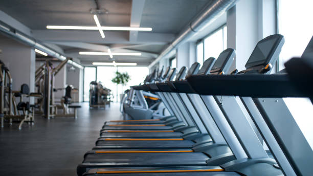 istock Treadmill machines in gym, safe distance and coronavirus concept. 1319585499