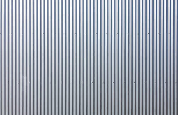 istock Texture of a wall made of silver corrugated sheet. 1319586445