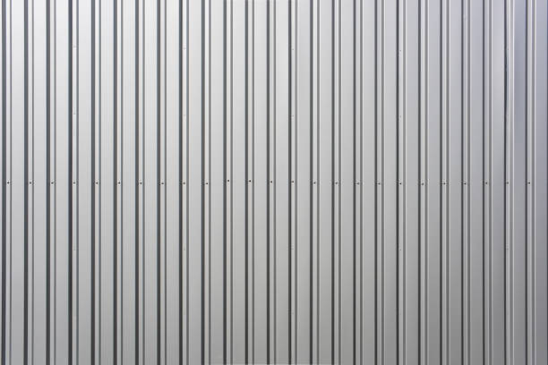 istock Texture of a wall made of silver corrugated sheet. 1319587023