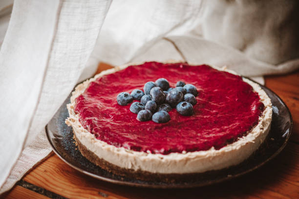 istock Vegan Cheesecake with Blueberry Sauce 1319587311