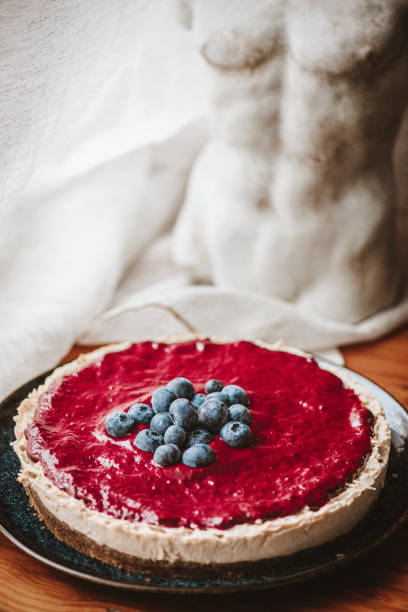 istock Vegan Cheesecake with Blueberry Sauce 1319588266