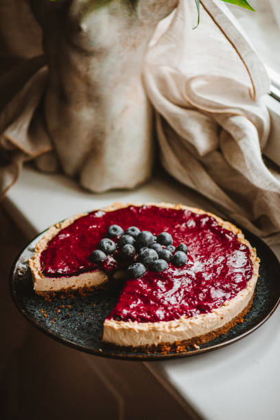 istock Vegan Cheesecake with Blueberry Sauce 1319588411
