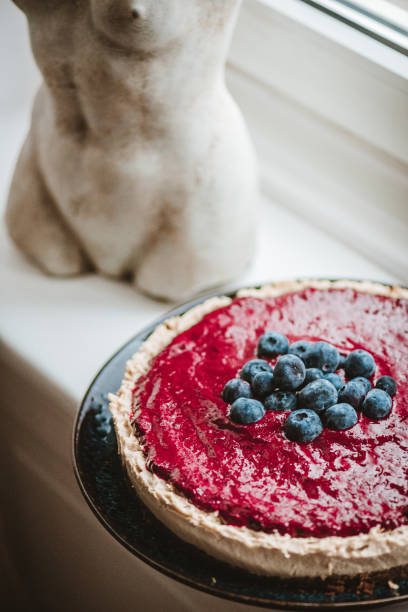 istock Vegan Cheesecake with Blueberry Sauce 1319588413