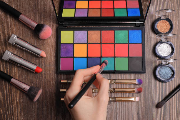 istock Makeup palette top view with brushes and lipstick 1319589908