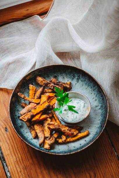 istock Air-Fried Sweet Potato Chips with Vegan Sour Cream 1319589941