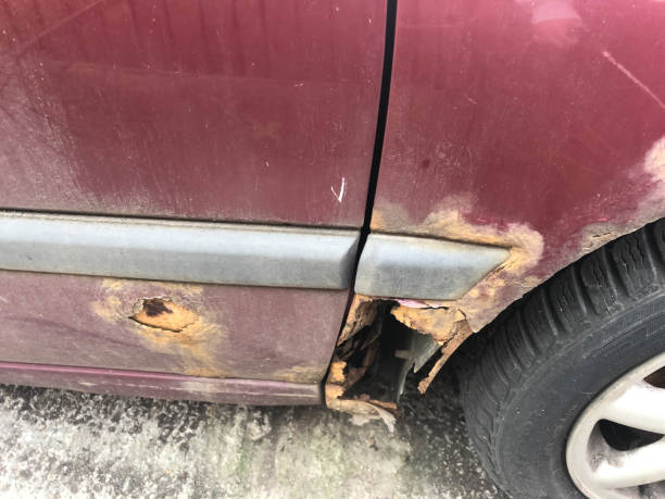 istock The rust made a hole in the car. 1319592486