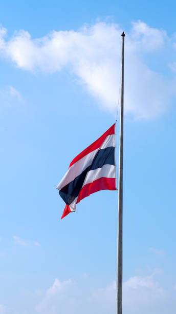 istock Thailand flag and clear blue sky and white clouds. 1319592734