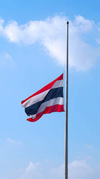 istock Thailand flag and clear blue sky and white clouds. 1319592735