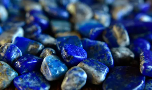 Lapis Is a beautiful natural gemstone on a wooden floor